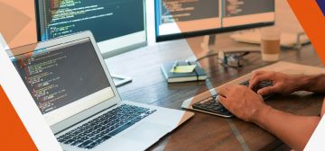 man using several computer screens